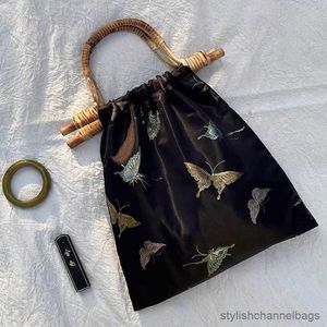 Spullen zakken rieten handgreep rattan tas vlinder handtas nylon zwarte draagtassen voor vrouwen 2023 strandtas reisontwerpers tassen nieuw