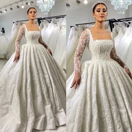 Vestido de novia de vestir de encaje impresionante para la novia Vestidos de novia de mangas largas Dubai Sweing Train Ruffle Arabic Saudita Vestidos nupciales