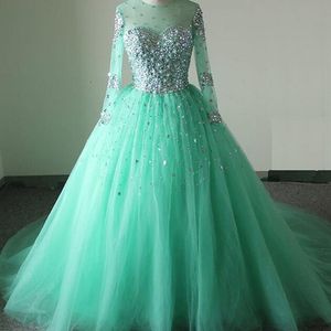 Superbe Robe De Bal Puffy Robe De Bal Turquoise Sheer Jewel Neck Illusion Manches Longues Cristaux Tulle Quinceanera Robes De Soirée Sur Mesure