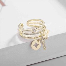 estilo Nuevo coreano micro-incrustaciones de circón cruz anillo abierto joyería temperamento mujeres marca de lujo de alta gama brillante circón 18k chapado en oro 228Y