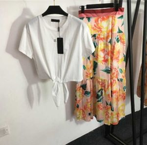 Verano fresco conjunto de dos piezas mujeres amarillo impreso media falda corbata nudo cintura camiseta de manga corta estampado floral vestido de cintura alta diseñador sexy faldas para mujer 55