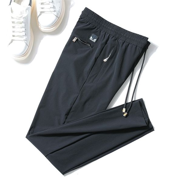 Pantalones finos casuales de moda de verano para hombre, pantalones largos de cintura elástica para hombre, telas cómodas y sedosas elásticas 201128