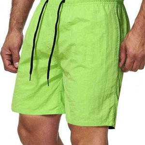 Été hommes shorts 2021 plage jambe large couleur unie séchage rapide cordon genou longueur hommes fitness shorts streetwear Y220420