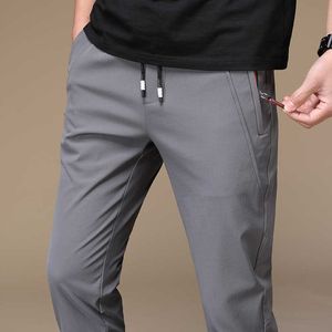 Pantalon de survêtement pour hommes d'été Pantalon mince chaud Pantalon de taille élastique en vrac Pantalon décontracté Pantalon Big Plus Taille 38 210707