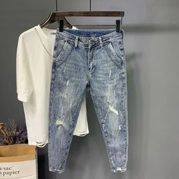 Zomerheren scheurde negen punt jeans mode elastische taille slanke passende leggings denim broek 240430