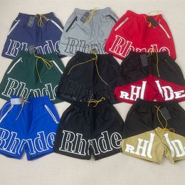 Été Hommes Femmes Rhude Shorts Mode Casual Leathier Genou Longueur Lâche Planche À Roulettes Hip Hop Pantalon De Bain Plage Rhude Poche Fermeture Éclair De Qualité Court Taille Asiatique S-XL