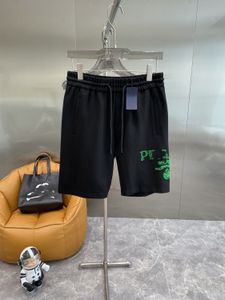 Summer New Men Women Pareja elástica de la cintura verde LOGTO Diseñador de estampado Shorts de algodón Pantalones de longitud de la rodilla