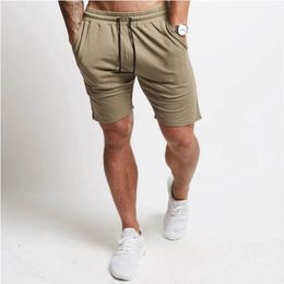 Été nouveau couleur unie coton hommes court Streetwear extérieur décontracté cinq pantalons survêtement entraînement Fitness pantalons de sport