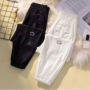 Été Plus Taille 4XL Pantalons pour femmes Jogger Taille haute Neuf points Big Pantalon de poche Pantalon blanc pour femmes 210531