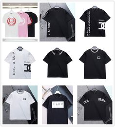 Nueva camiseta para hombre Letras impresas de hip hop sueltas en negro, blanco y rosa con 230 g de hebras dobles, 32 telas ajustadas de algodón de doble hilo, tela suave para hombres y mujeres con el mismo M-3XL