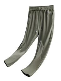 Pantalon de survêtement droit des hommes en nylon glacé respirant extension pantalon long mâle pantalon de piste décontractée plus taille 8xl 240423