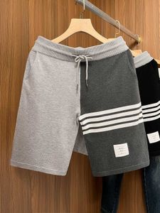 Zomer trendy stijl shorts voor heren vier bar sporten losse en ademende gebreide nieuwe Chinese kwartbroek