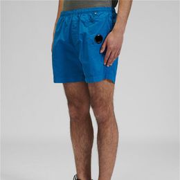 Pantalones cortos de nailon para deportes informales al aire libre para jóvenes de verano, pantalones sueltos de playa para hombres, 5 puntos