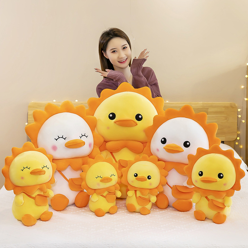 Sun duck peluche giocattoli creativi nuovo piccolo regalo di compleanno per bambini bambola anatra gialla grande cuscino all'ingrosso
