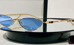 Lunettes de soleil métal cadre oeil de chat femmes avec des breloques en forme de coeur Style de mode dame Eyewear4051267