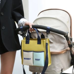 Levert babyluierzak kleurblok kraamtas een schouder messenger dame handheld baby flesje tas moeder baby kinderwagen tas