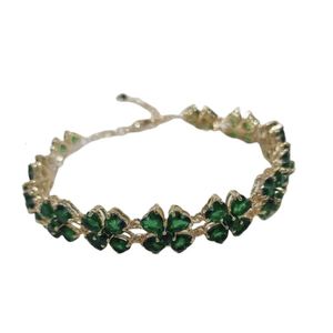 Bracelet Swarovski Designer Femmes Bracelet de qualité supérieure Bracelet d'herbe chanceuse plein de quatre feuilles avec des éléments d'hirondelle cristal vert femme