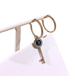 Pendientes Swarovskis de diseñador para mujer, pendientes asimétricos con llave de ojo de diablo, elemento femenino, pendientes con llave de cristal