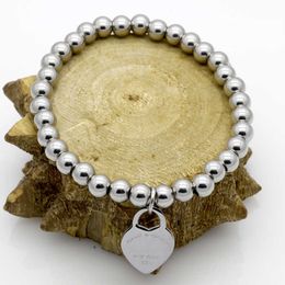 T Familie roestvrijstalen handdecoratie Peach hart Bracelet Round Bead Chain Dames titanium stalen sieraden2024