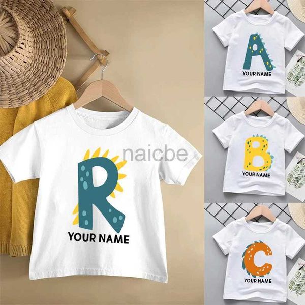 T-shirts personnalisés de garçons initiaux filles dinosaur t-shirt mignon alphabet a-z nom personnalisé tee tee tee tee tee thend children anniversaire dino cadeau tshirt 240410