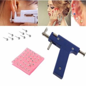 Tattoo Guns Kits Est Professionele roestvrijstalen body Navel Ooor Neus Piercing pistool 72pcs Oren studs Toolkit Topkwaliteit Sieradengereedschap