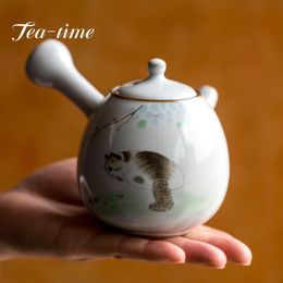 Téage de thé à la main