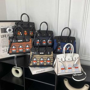 Tempérament Sac pour femmes Nouvelles couleurs de contraste classique petite maison 25 cm sac à main une épaule à cheval diagonale sacs de sacs pour femmes