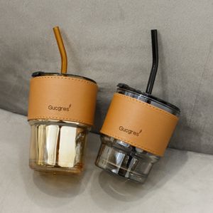 La dernière tasse en verre de paille de café portable de 15,2 ozs avec couvercle, disponible dans une variété de styles et support des logos personnalisés