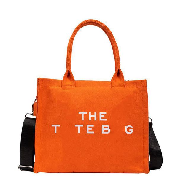 Le sac fourre-tout de luxe mode sacs à bandoulière en toile sac à main de créateur sac de plage décontracté classique pour femme sac de shopping haute capacité saint valentin couleur orange