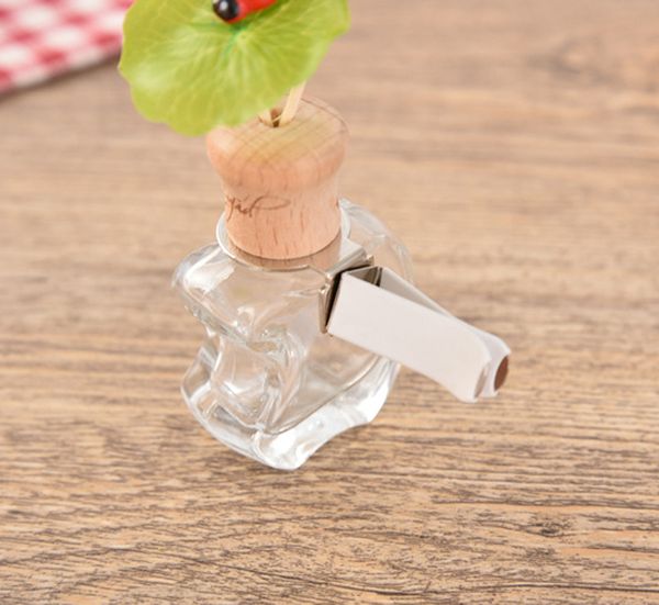 Les mini bouteilles de diffuseur de voiture suspendues les plus populaires bouteille de parfum de voiture vide en verre bouteille d'huile essentielle de parfum pour la vente en gros