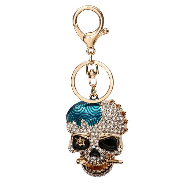 El nuevo llavero de calavera de metal creativo de diamante europeo y americano, los fabricantes tridimensionales de colgantes de bolsa de coche de hip hop suministran directamente