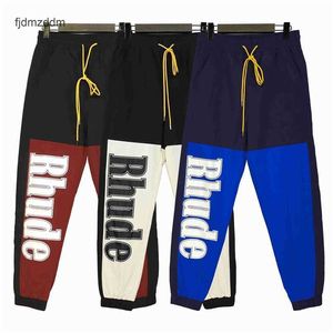 De juiste versie van Meichao Rhude Letter-gedrukte kleurcontrast Hip-hop trend Casual geweven broek leggings