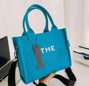 Le sac fourre-tout femmes grands sacs de créateurs sacs à bandoulière en toile sac à main capacité pratique voyage travail luxe mode Totes3027
