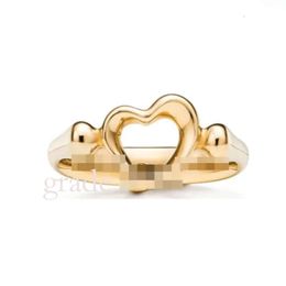 Tiffanyco Anillo de diseño clásico Top Fashion T Ring Inicio Plata esterlina En forma de corazón Nudo de hoja Anillo de pegamento por goteo con joyería en T de diamante chapada en oro Alta calidad 979