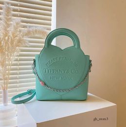 Tiffanytote diseñador Bolsa para mujer Ins Cadena de letras Un hombro Crossbody Tiffanyity Bag Patrón Litchi Capacidad de bolso de bolso versátil 918