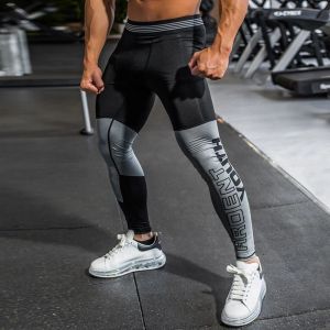 Collants Nouveaux pantalons de course de compression Hombre Sport Leggings pour hommes Sport Legging Tissu de tissu artisanat Pantalon Fitness Men Slim