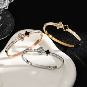 Titanium diamant ingelegde vierbladige grasarmband voor dames, veelzijdige en hoogwaardige open-end armband, roestvrijstalen sieraden