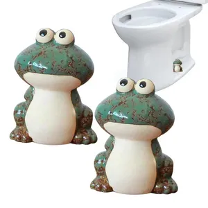 Le siège de toilette couvre la grenouille décorative en céramique de boulon de porcelaine pour les chapeaux mignons de cuvette de vis