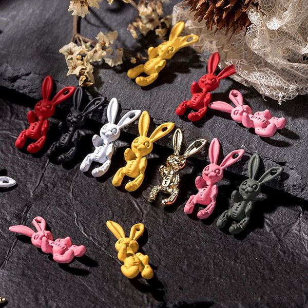 Outil 100pcs / lot 20 * 9 mm Skull lapin nail art décorations 7 couleurs mignonnes squelette squelette bijoux de lapin metal accessoires mat en vrac