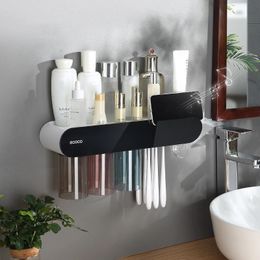 Porte-brosse à dents mural porte-brosse à dents Adsorption magnétique tasses inversées presse-dentifrice automatique étagère de rangement de toilette 231013
