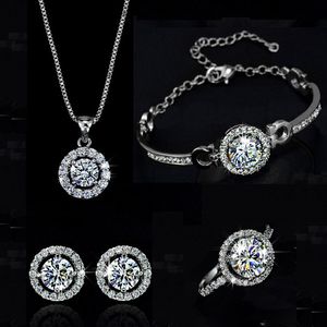 Topkwaliteit prachtige kristallen vrouwen bruiloft ketting oorbel armbanden ring sieraden set verzilverde zirkonen sieraden voor bruid