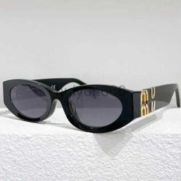 top Zonnebril Dames hetzelfde type ovaal frame lenzenvloeistof klassieke ontwerper anti-glare UV400 premium plaat zonnebril M054 met doos