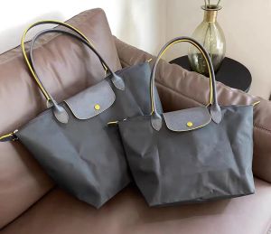 sac fourre-tout sac de créateur de haute qualité portable dumpling dumpling sacs loisirs sac à main en nylon sac à bandoulière de luxe sacs de voyage de plage