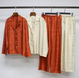 Camisa de manga larga de seda de morera geométrica toteme para mujer + pantalones de cintura alta elásticos