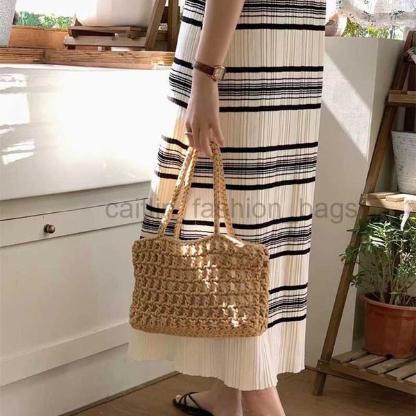 Totes 2023 Nuevo botón de moneda de cobre Algodón hecho a mano Medio vacío Bolso con forrado Bolso tejido Handmesh Cut Straw Bag Casual Woven Bag Caitlin_Fashion_Bags