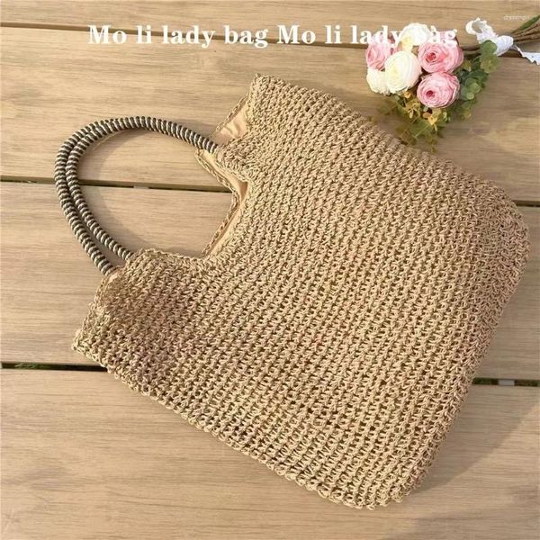 Totes Vacaciones de verano Bolsa de playa Casual Paja tejida hecha a mano Cubo Bolso de mujer Bolso de hombro de gran capacidad