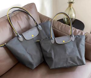 Fourre-tout sac fourre-tout sac de créateur de haute qualité portable sac de boulette loisirs sac à main en nylon sac à bandoulière de luxe sac de voyage de plage