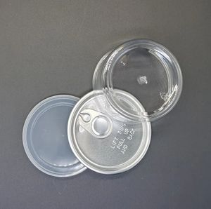 Botellas transparentes de envasado de alimentos de plástico para mascotas en latas selladas circulares de stock