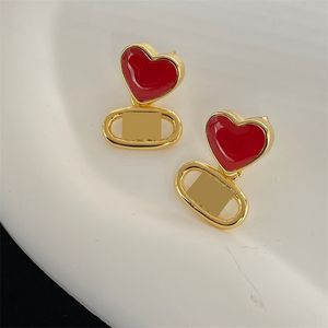 Transparent Ruby Heart Love Charm Advanced Gold Oval Dangle Boucles d'oreilles Lady Light Hollow Ear Stud avec boîte