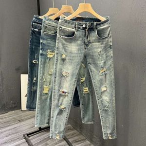 Mendigar à la mode Perforé Perforé Pantalon Spring / été coréen Pantalon Terre Elastique Pi Shuai Nine Pantalon